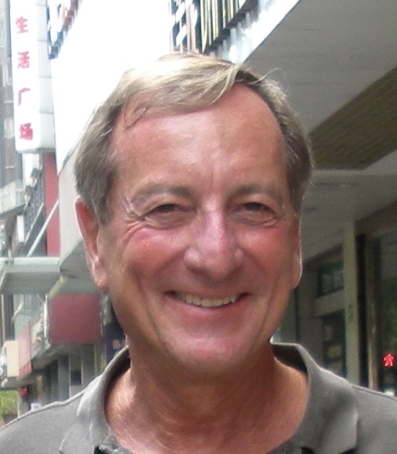 Larry Rubenstein smiling outdoors